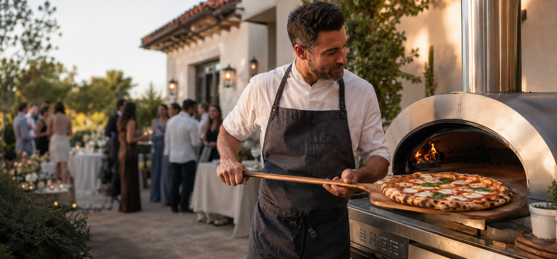 Chef serving a fresh Margherita pizza to guests at an Orange County evening catering event